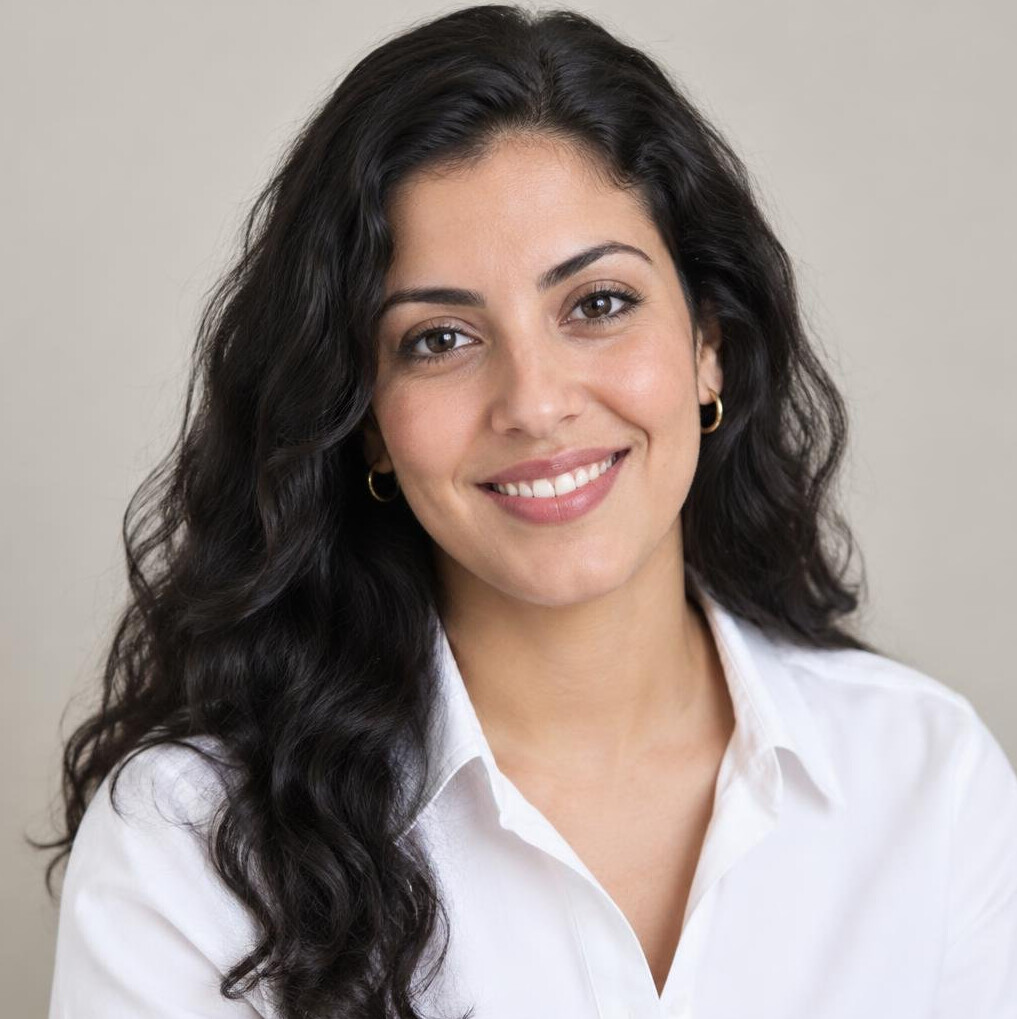 Portrait of a young woman with dark hair smiling